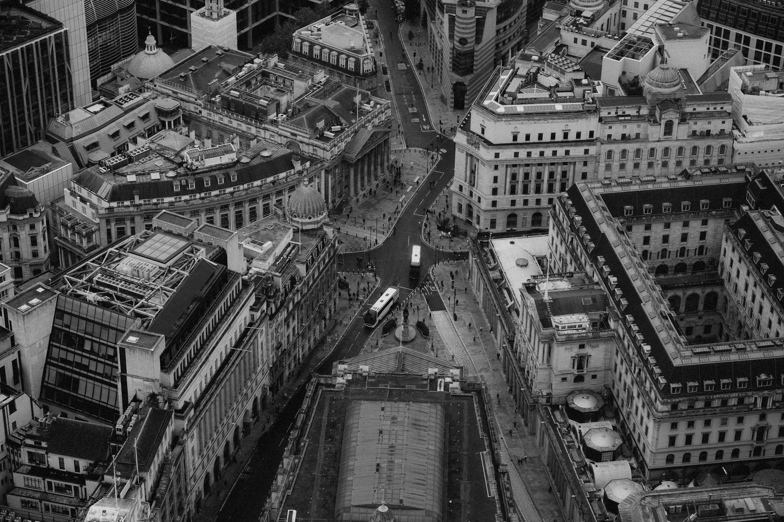 Black and white aerial shot of London's iconic financial district with historic architecture.
