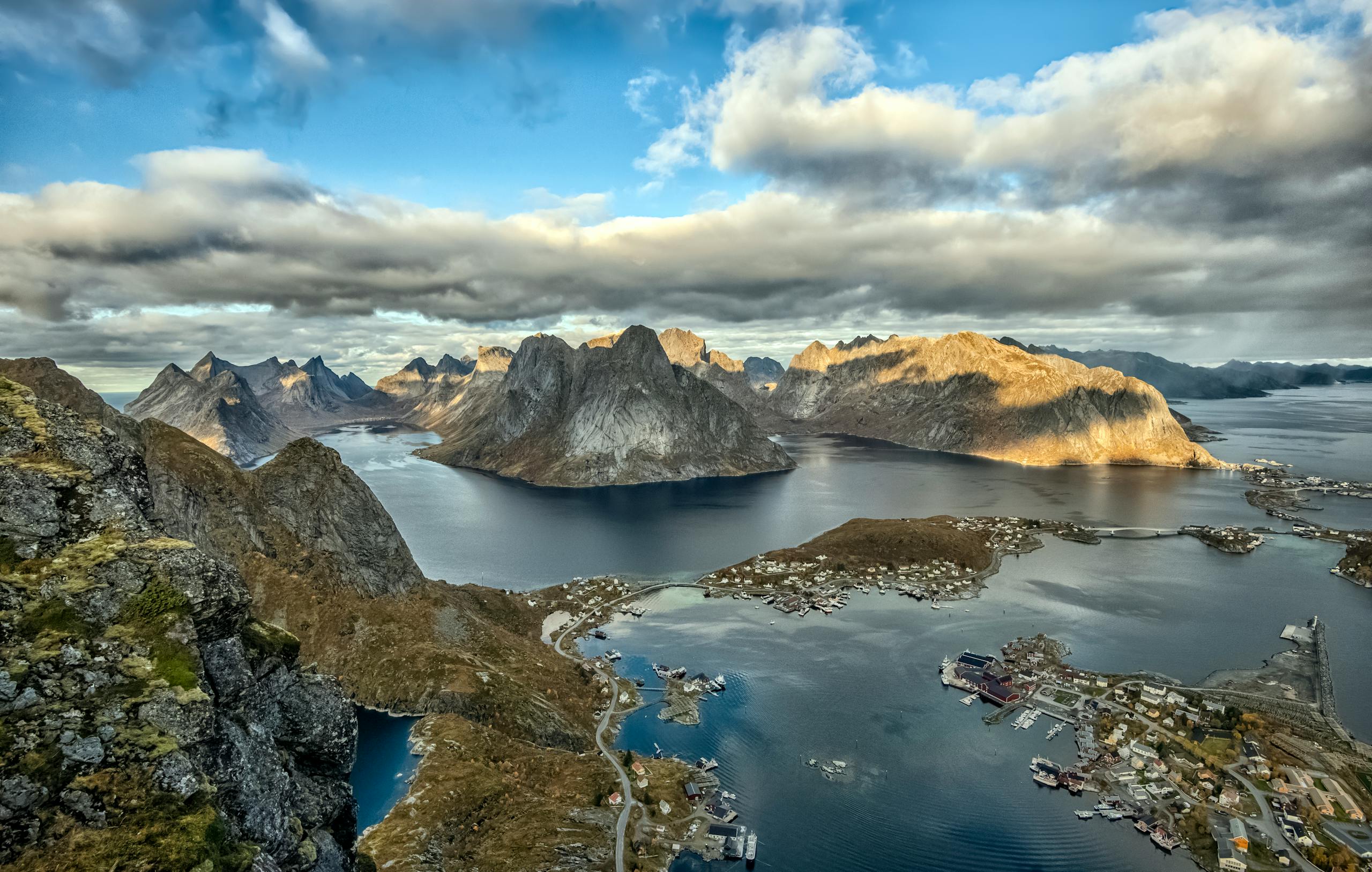 Breathtaking aerial view of the Lofoten archipelago with dramatic mountains and coastal villages.